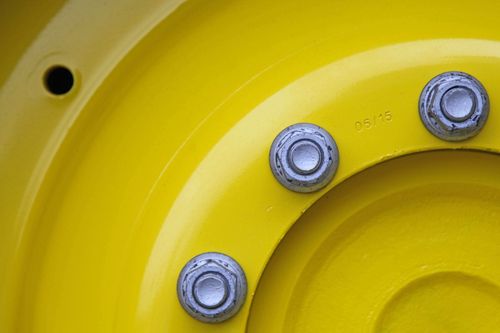 Två män åtalas nu för grovt häleribrott sedan polisen hittat en mängd stulna fordon, bland annat en stulen traktor värd 400 000 kronor på familjens gård.